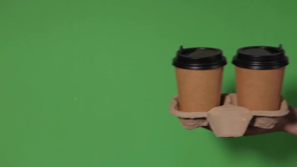 Close Green Background Woman Hand Holds Paper Cup Coffee Stand — Stock Video