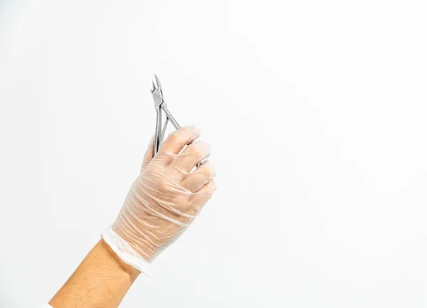 Close Gloved Podiatrist Hand Holding Shears White Background — Stock Photo, Image