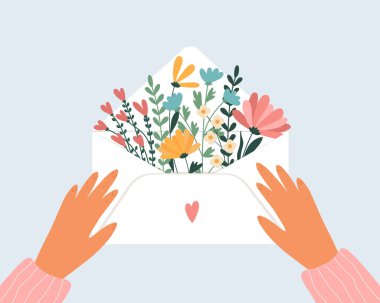 Elinde aşk zarfı ve etrafında çiçekler.