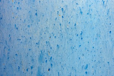 detail of a rusty blue texture on an old metal door