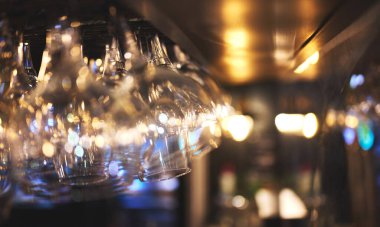 details of wine or beer glasses hanging on a restaurant bar