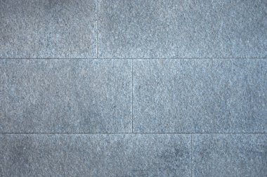 Gri taş bloklardan yapılmış bir cephenin ayrıntıları