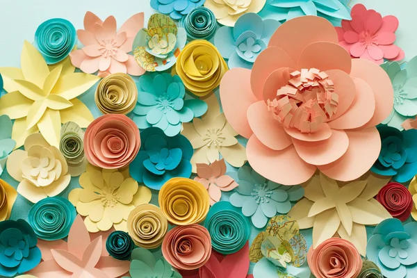 Vintage paper flowers. Pink, Blue, yellow and White flowers paper background pattern lovely style. Rose made from paper.