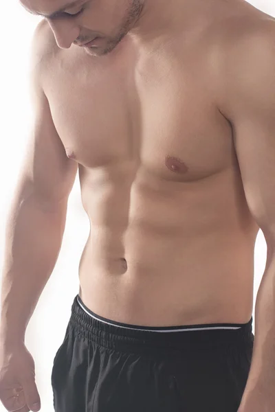 Halv nakna sexiga kropp muskulös atletisk idrottsman, isolerad på vit — Stockfoto