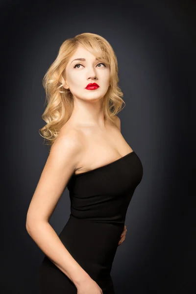 Blond Hair. Beautiful Sexy Blonde Girl. Beauty isolated on a Black Background — Stock Photo, Image