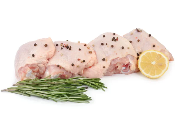 Chicken leg quarters on the white background with greens Royalty Free Stock Images