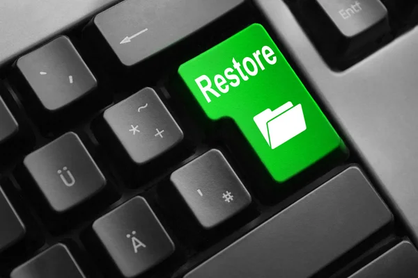 Серая клавиатура зеленая кнопка восстановить папку онлайн — стоковое фото