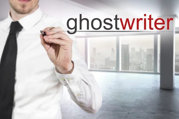 Businessman writing ghostwriter in the air — Stock Photo, Image