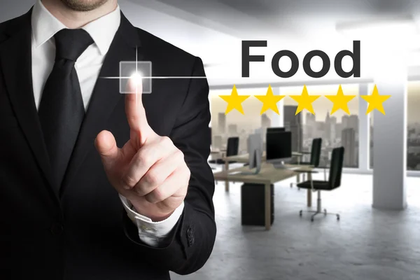 Businessman pushing small button food five stars — Stock Photo, Image