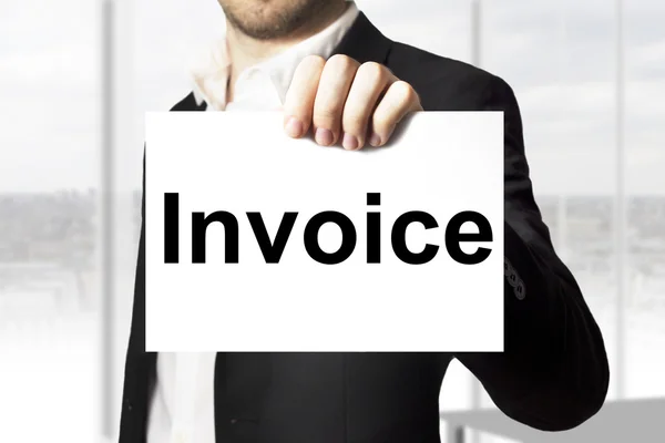 Businessman holding sign invoice payment — Stock Photo, Image