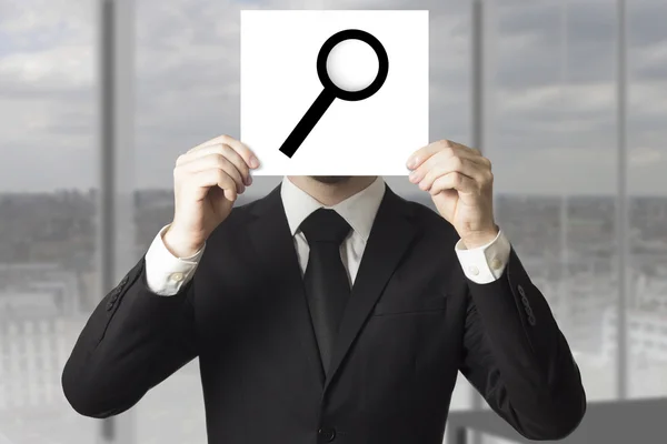 Businessman hiding face behind sign loup magnifier — Stock Photo, Image