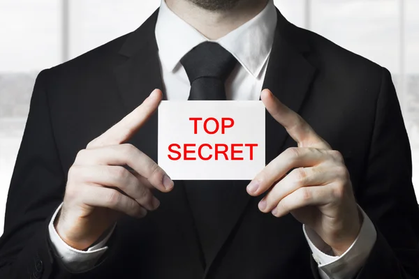 Businessan holding sign top secret — Stock Photo, Image