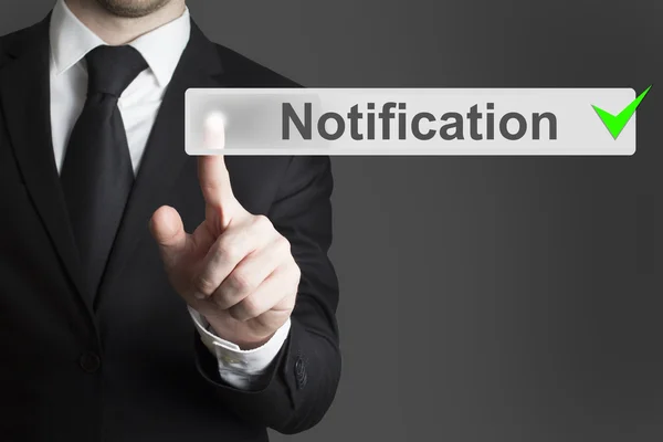 Businessman pushing button notification — Stock Photo, Image