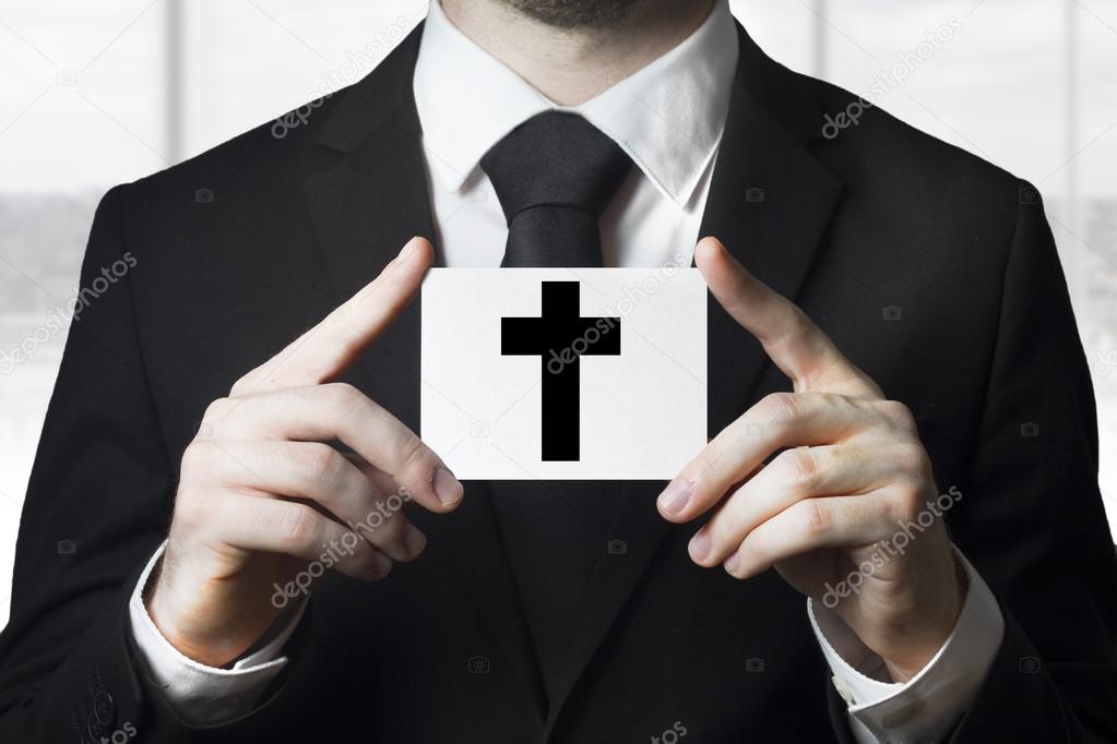 undertaker man holding sign black cross funeral