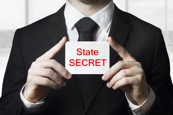 Businessman holding sign state secret — Stock Photo, Image