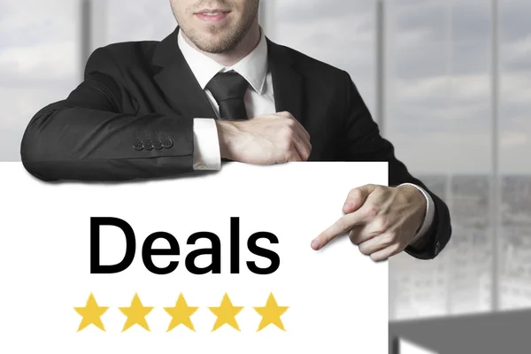 Businessman pointing on sign deals golden rating stars — Stock Photo, Image