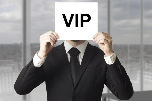 Businessman hiding face behind sign vip — Stock Photo, Image