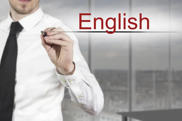 Businessman writing english in the air — Stock Photo, Image