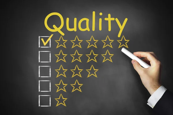 Hand writing quality on chalkboard rating stars — Stock Photo, Image