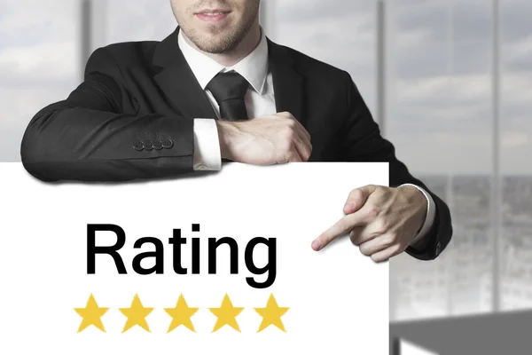 Businessman pointing on sign rating stars — Stock Photo, Image