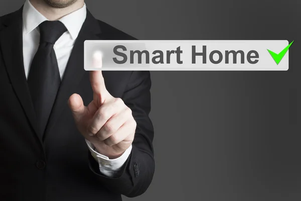 Businessman pushing flat button smart home — Stock Photo, Image