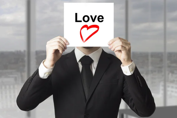 Businessman hiding face love heart symbol — Stock Photo, Image