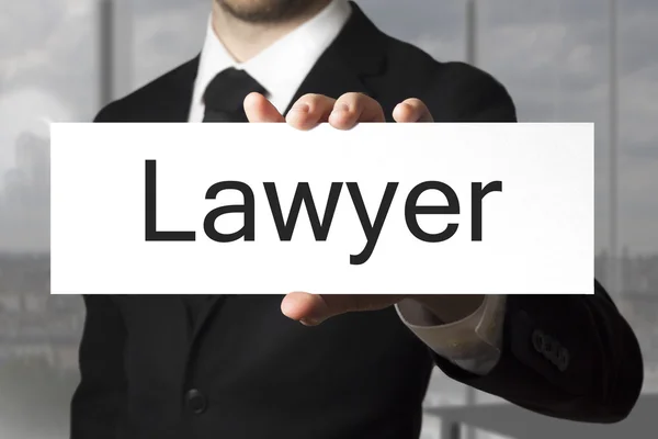 Businessman holding sign lawyer — Stock Photo, Image