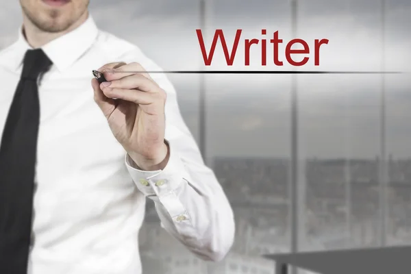 Businessman writing writer in the air — Stock Photo, Image