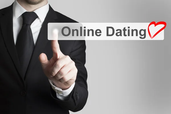 Biznesmen naciskając przycisk płaski online dating serce symbol — Zdjęcie stockowe