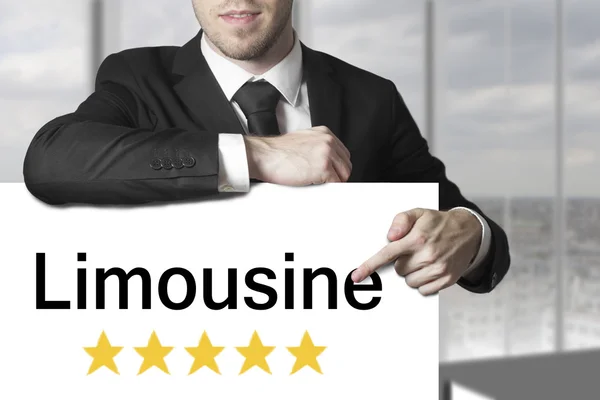 Businessman pointing on sign limousine five stars — Stock Photo, Image