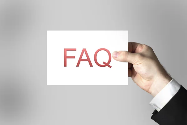 Mano che mostra il segno faq domande frequenti — Foto Stock