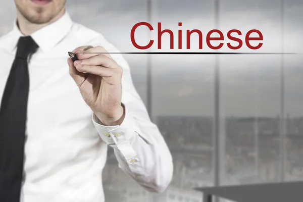 Businessman writing chinese in the air language — Stock Photo, Image