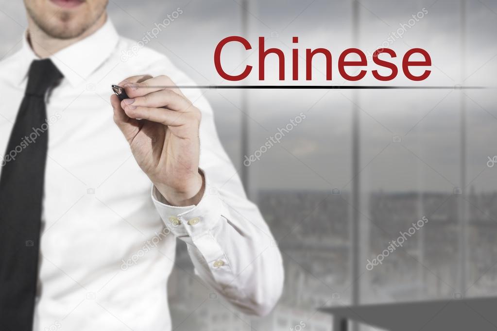 businessman writing chinese in the air language