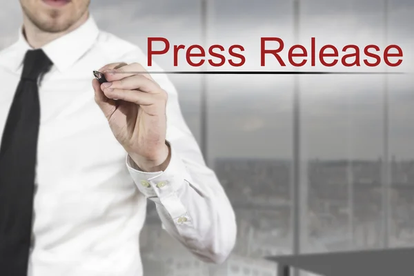 Businessman writing press release in the air — Stock Photo, Image