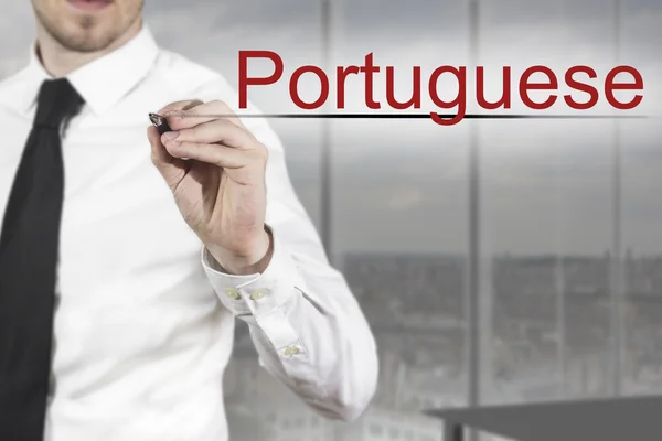 Empresário escrevendo no ar português — Fotografia de Stock