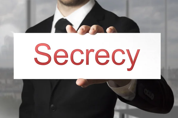 Businessman holding sign secrecy — Stock Photo, Image