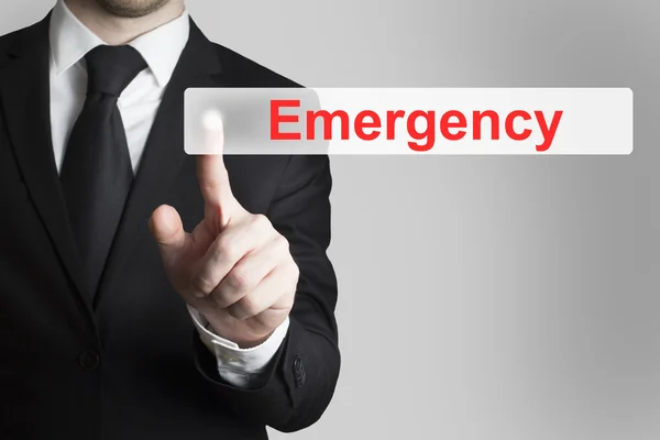 Hombre de negocios pulsando botón plano de emergencia —  Fotos de Stock
