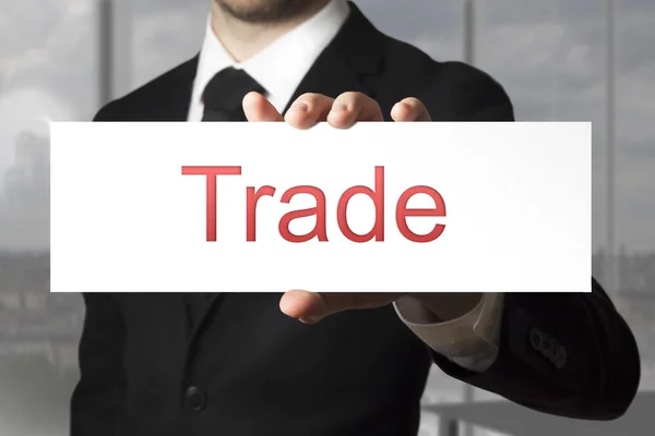 Businessman holding sign trade — Stock Photo, Image