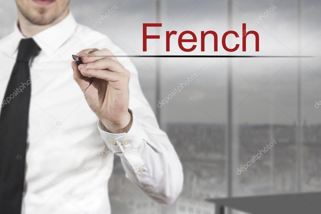 businessman writing french in the air