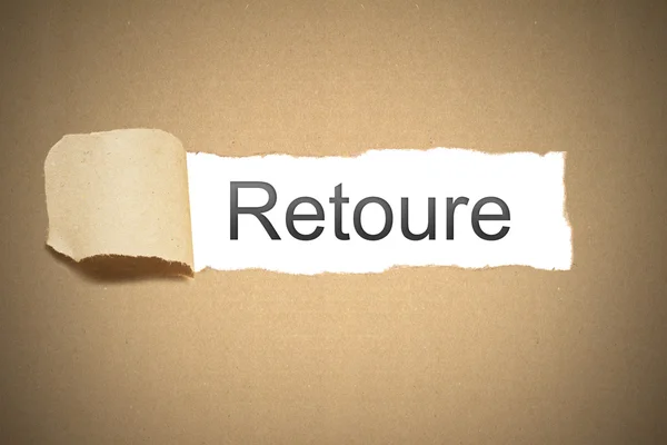 Brown paper torn to reveal retoure — Stock Photo, Image