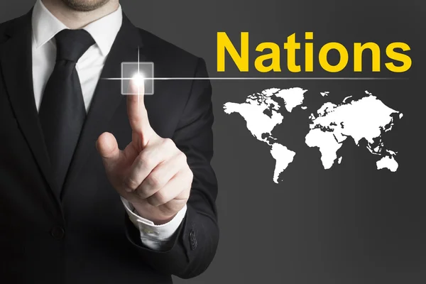 Businessman pushing button nations world — Stock Photo, Image