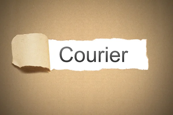 Brown paper torn to reveal courier — Stock Photo, Image