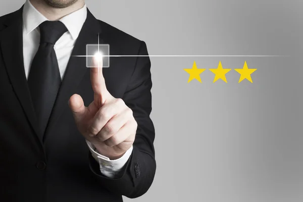 Businessman pushing button three rating stars — Stock Photo, Image