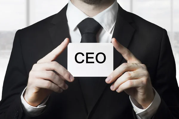 Businessman holding sign ceo — Stock Photo, Image