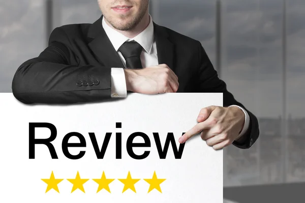 Businessman pointing on sign review golden stars — Stock Photo, Image