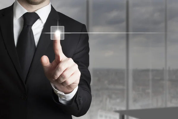 Businessman in suit pushing small touchscreen button — Stock Photo, Image