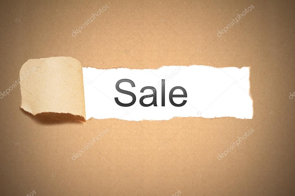 brown paper torn to reveal sale