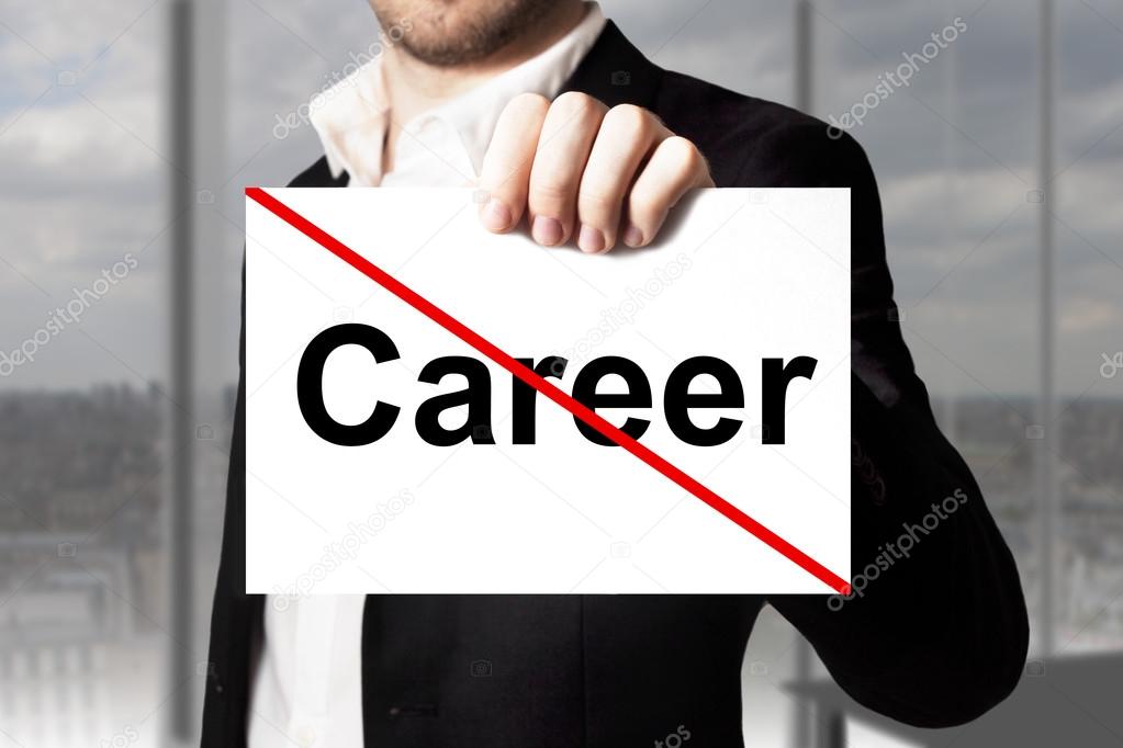 Businessman holding sign crossed out career
