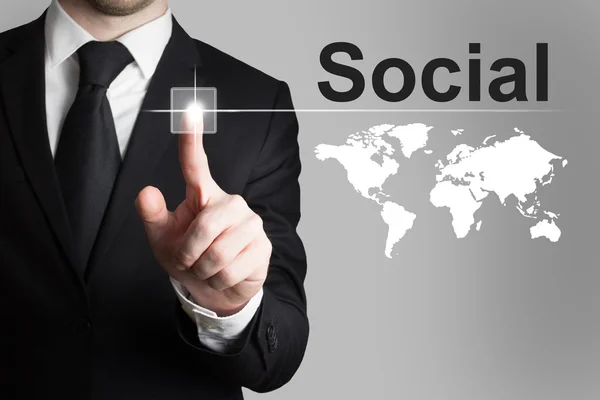 Business man pushing button social international — стоковое фото