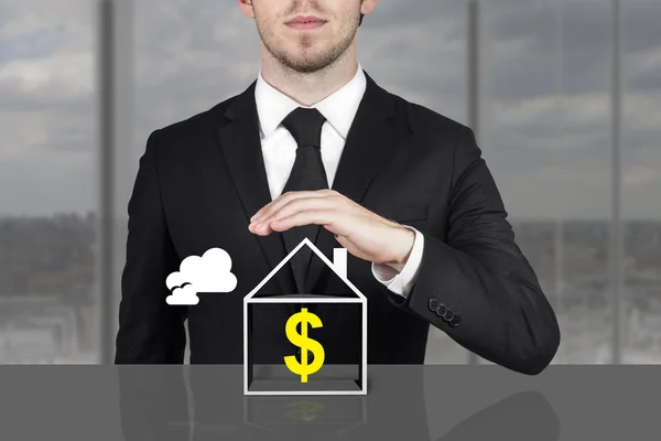 Businessman holding protective hand above house dollar symbol — Stock Photo, Image